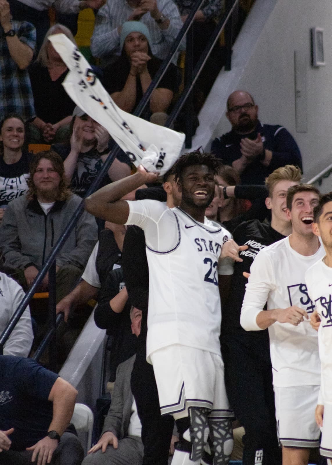 Portugal’s Neemias Queta cheers a Utah State teammate during the Aggies’ February 2020 game against San José State — club Europe to Mountain West to the NBA.