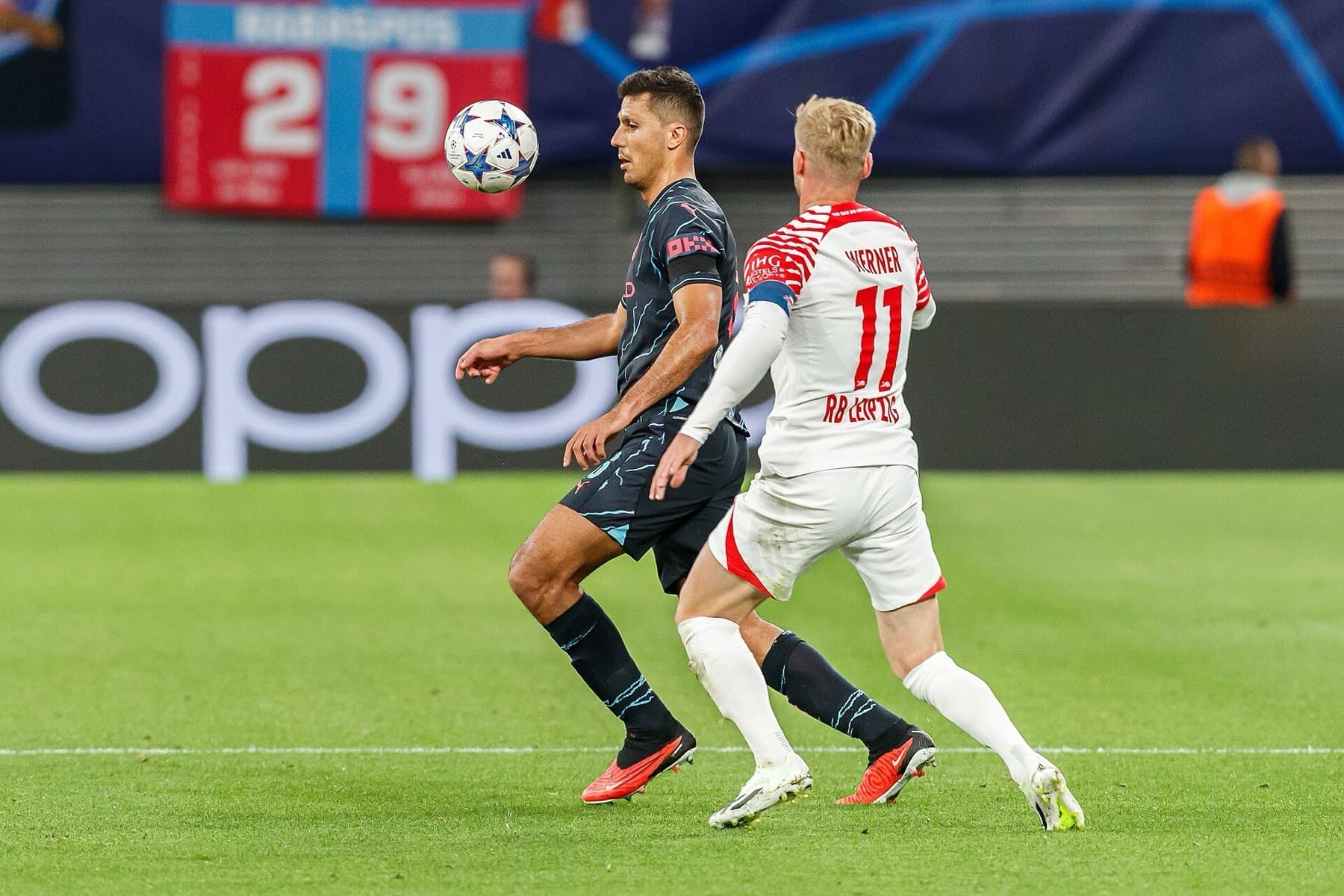 Manchester City’s Rodri controls under pressure from RB Leipzig’s Timo Werner in the Champions League in October 2023 — the pivot’s job of holding the platform while teammates attack ahead of him.