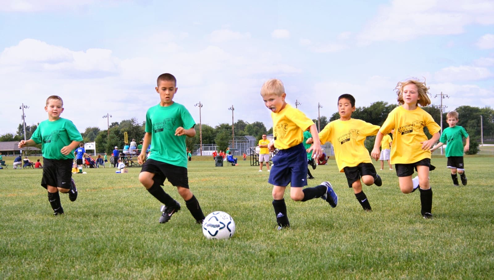 Youth soccer on a community field in Indiana — the club fees, travel, and equipment that stack before elite pathways begin.